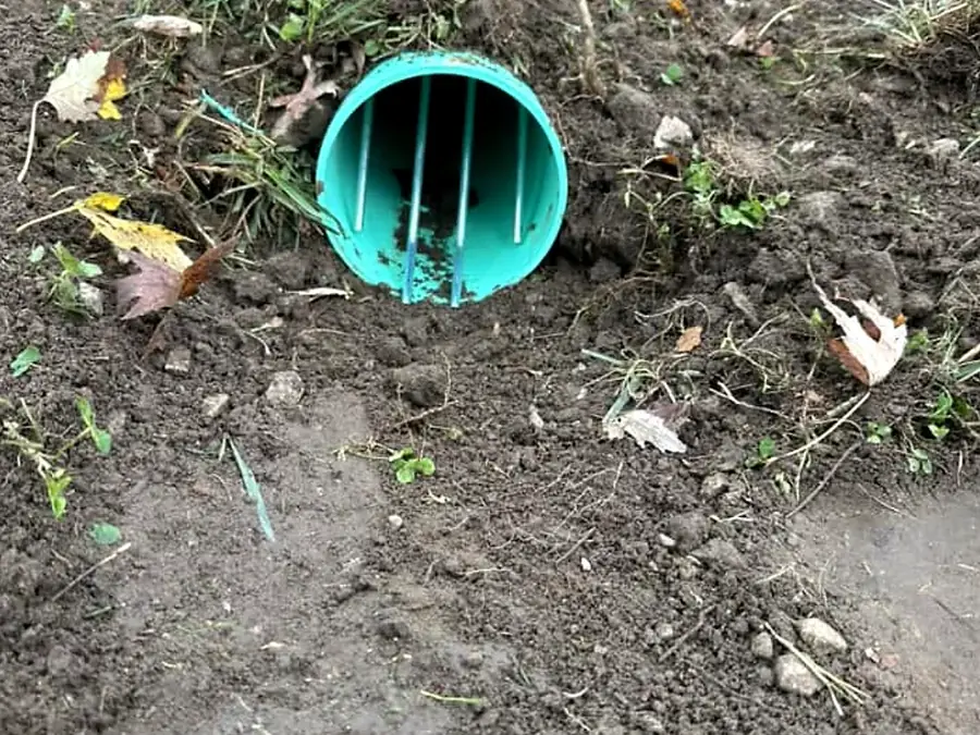 Green corrugated culvert pipe laid in a trench