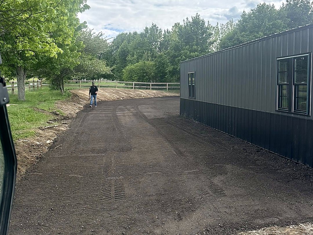 Compacted base running the full length of a metal building